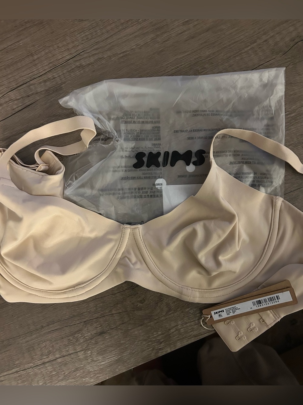 SKIMS Fits Everybody Unlined Demi Bra in the color Sand